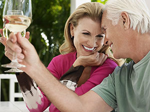 Middle aged couple drinking wine